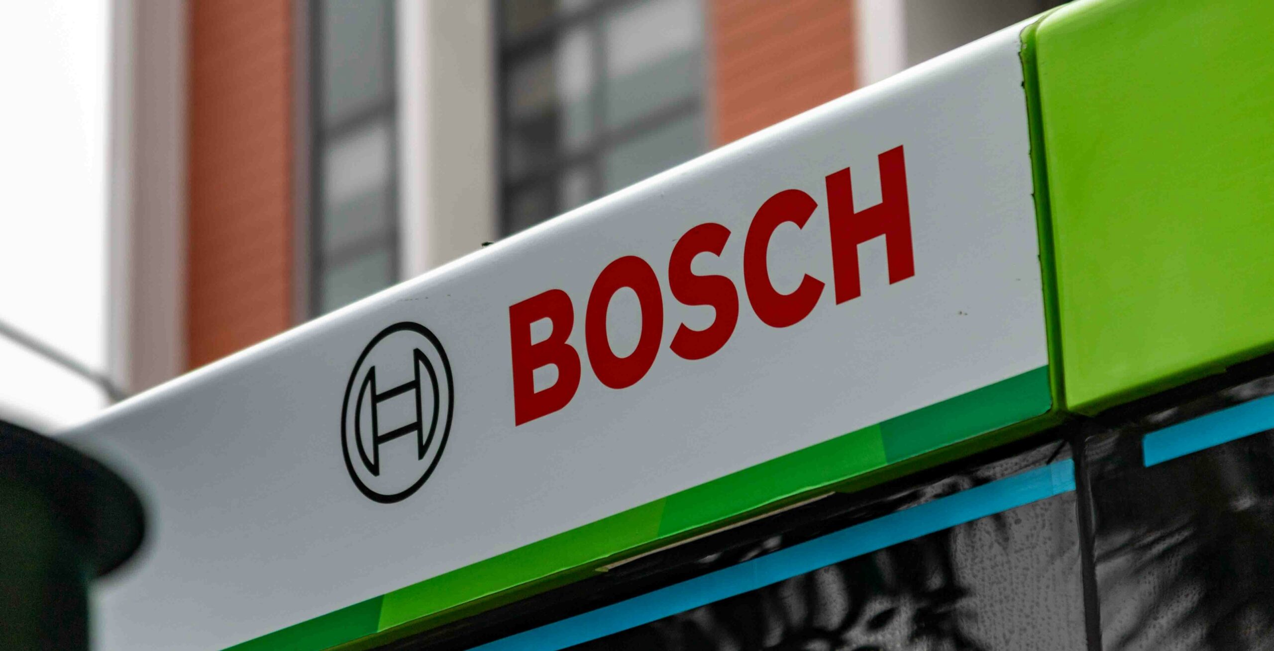 Bosch logo on a green and white vehicle - Bosch EasyImpact 18V-40 review: a good DIY drill, but know its limits