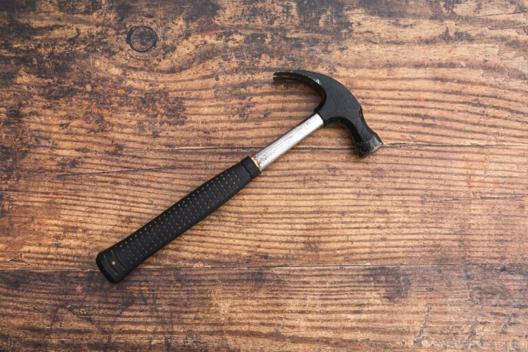 Tools on a table. Hammer on a workbench - Choosing the Right Hammer for Your Home Repair Needs