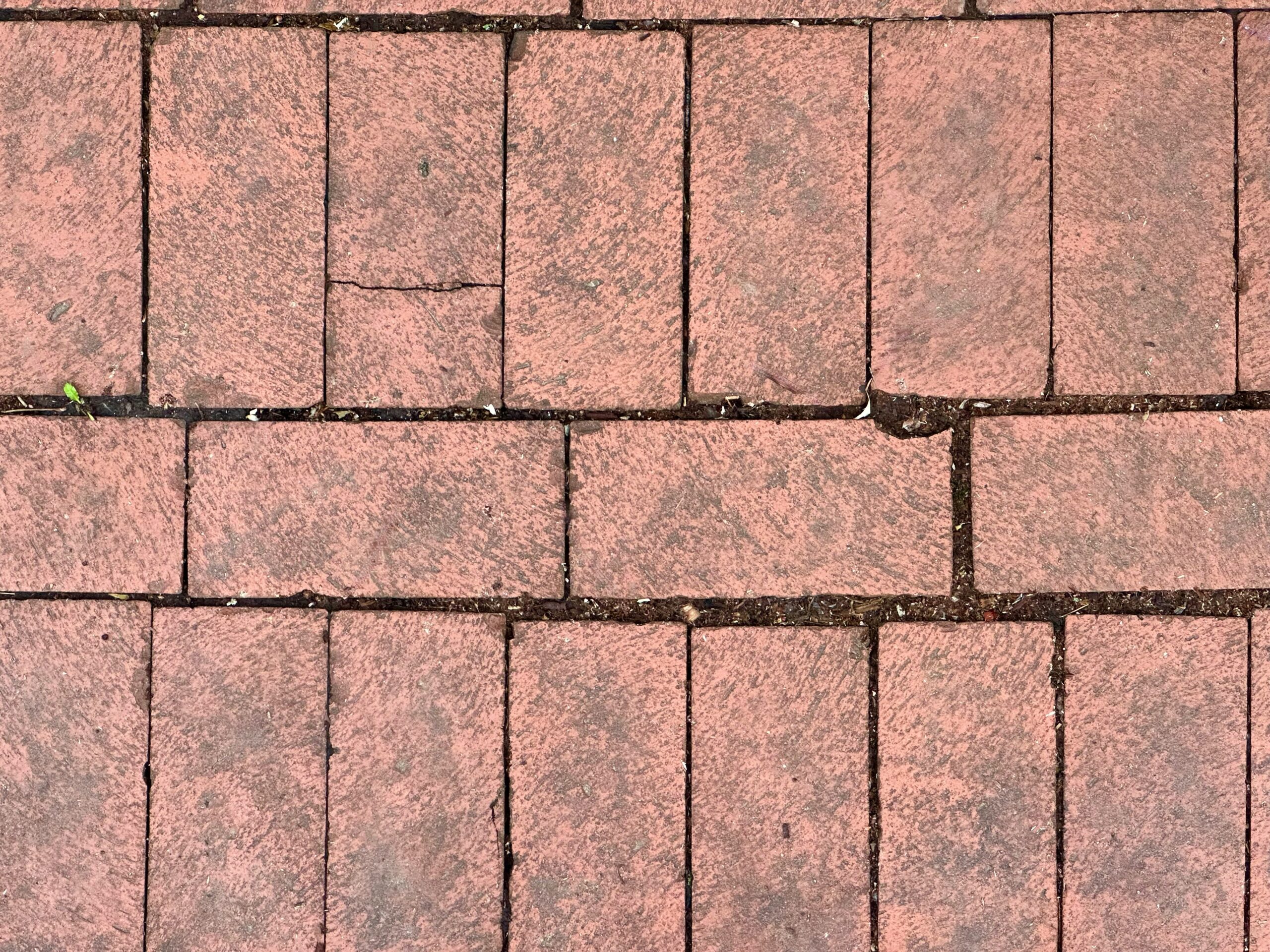 A red brick sidewalk texture - How to Fix Uneven Patio Slabs