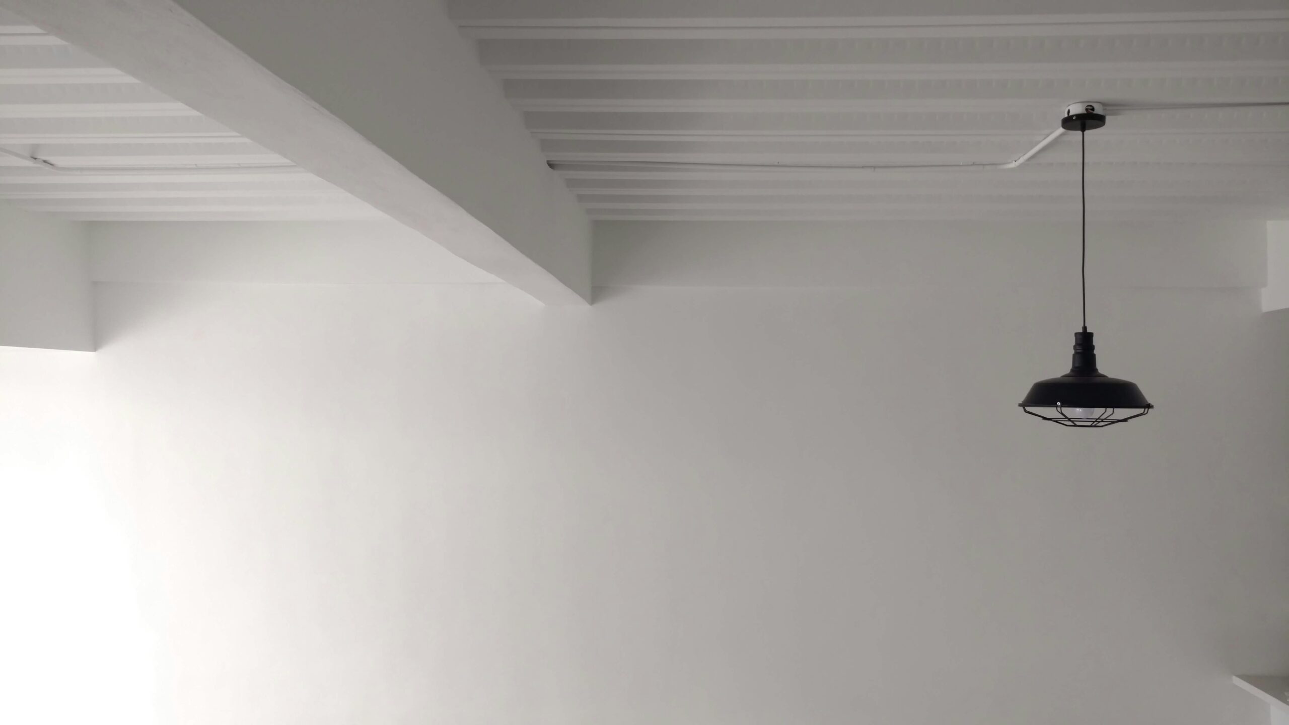 Black pendant light - How to Patch a Hole in Drywall Quickly and Effectively