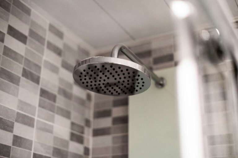 Grey stainless steel shower head - How to Reseal a Shower Tray to Prevent Leaks