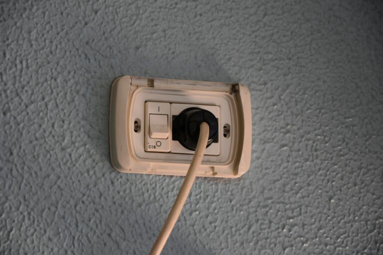 A light switch with a wooden stick sticking out of it - How to Rewire a Plug Safely and Efficiently