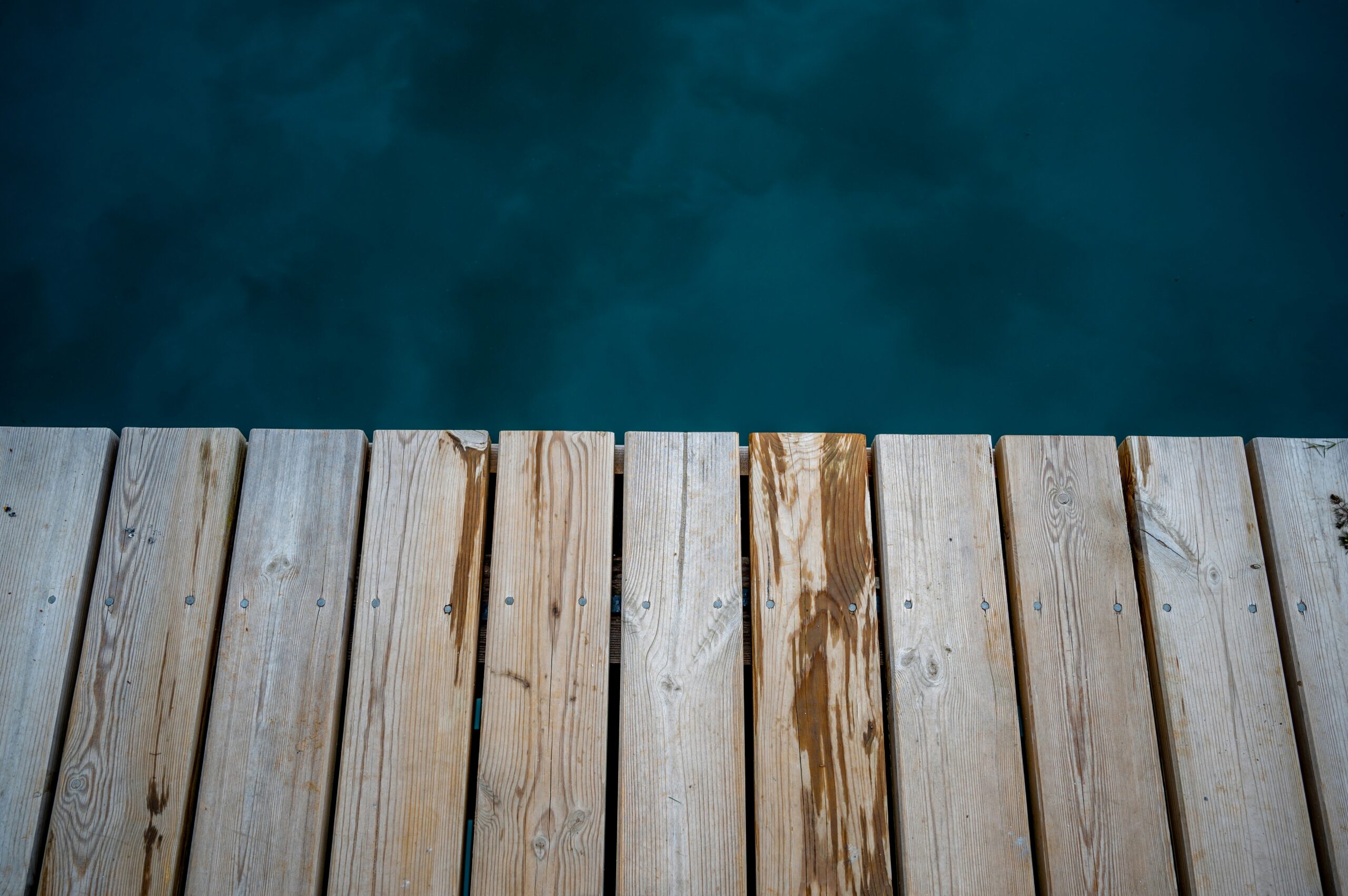 A wooden dock next to a body of water - Best Jigsaws for Woodworking Enthusiasts