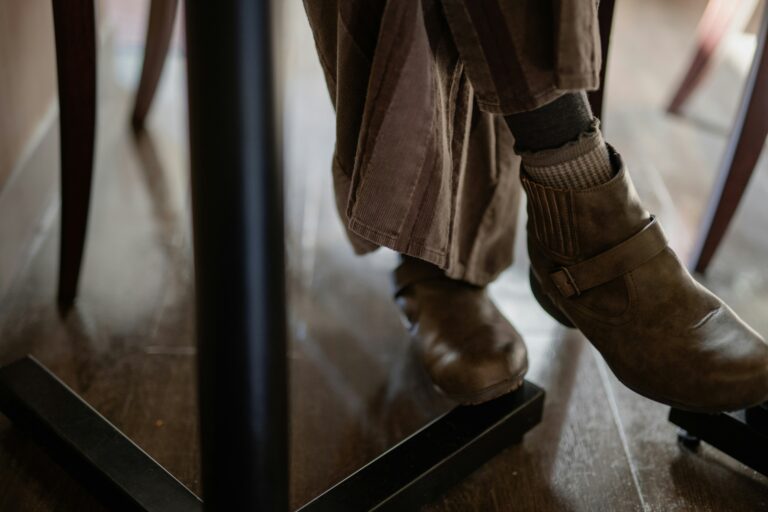 a person standing on top of a wooden floor