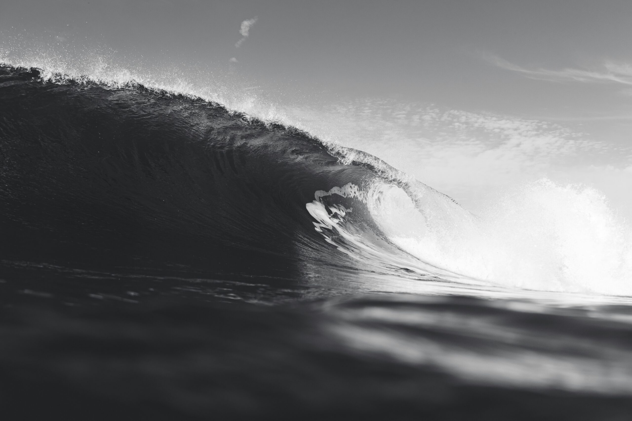 a person riding a wave on top of a surfboard